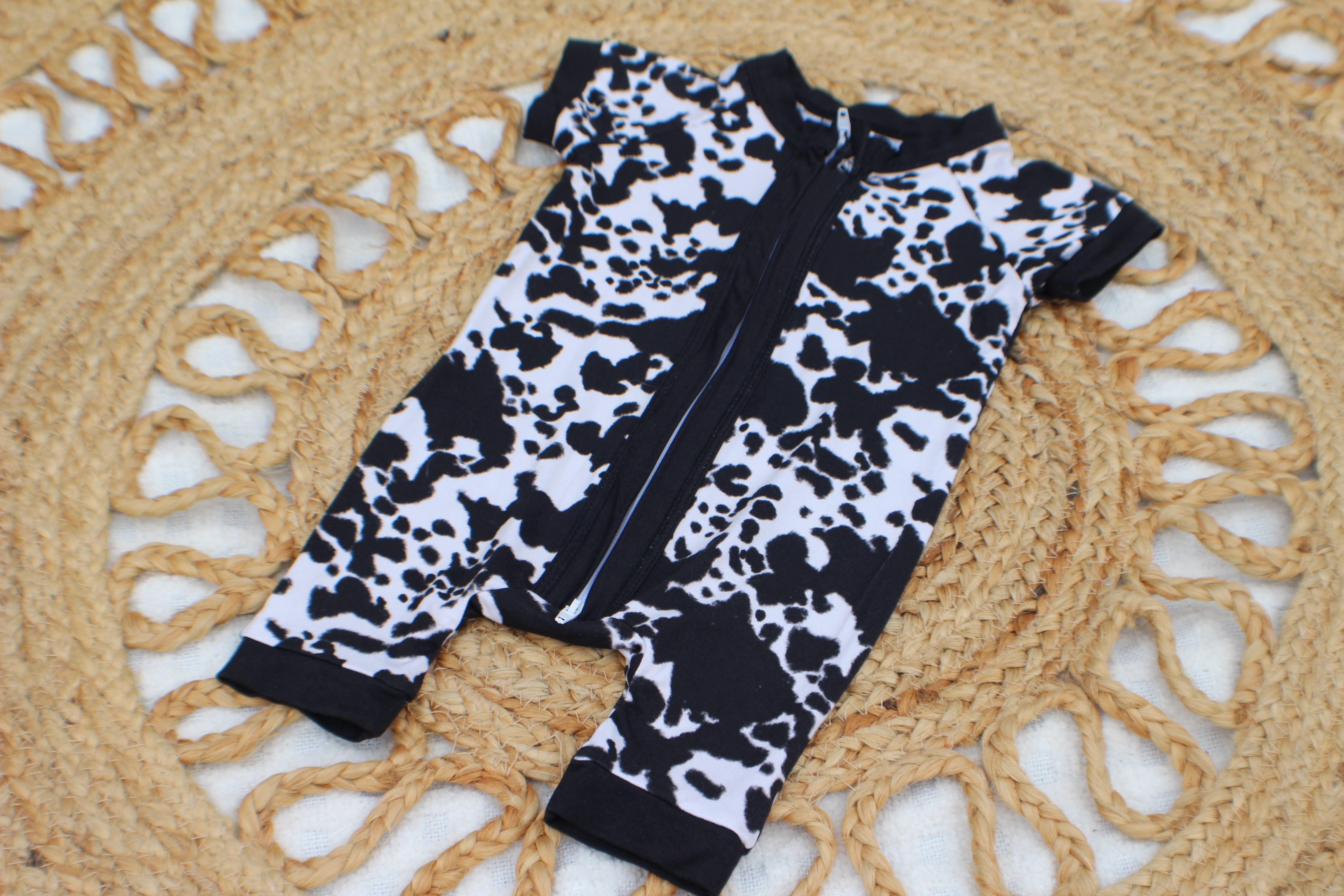 Black Cow Print Zippy