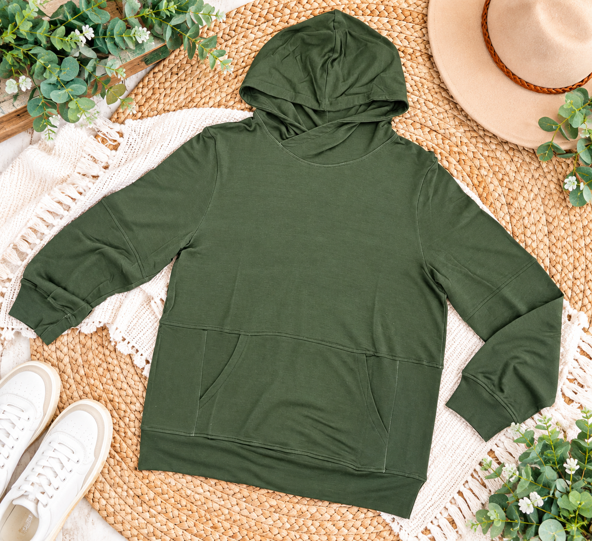 a green hoodie on a rug