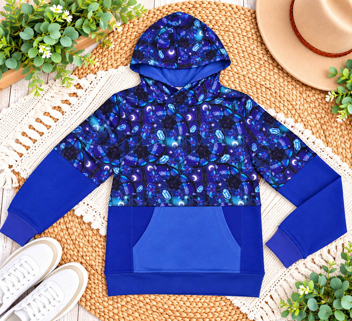 a blue hoodie on a rug