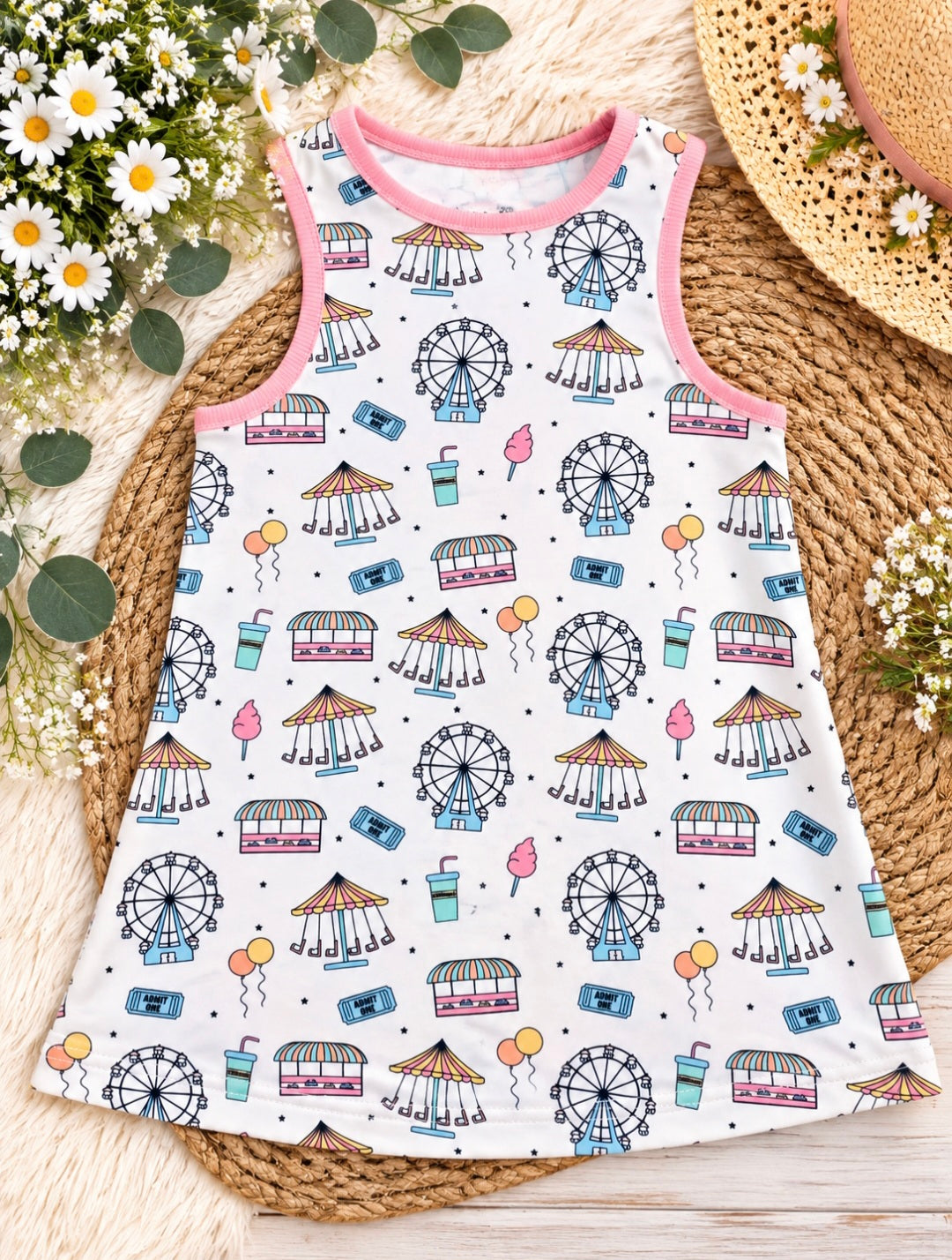 a white and pink dress with drawings on it